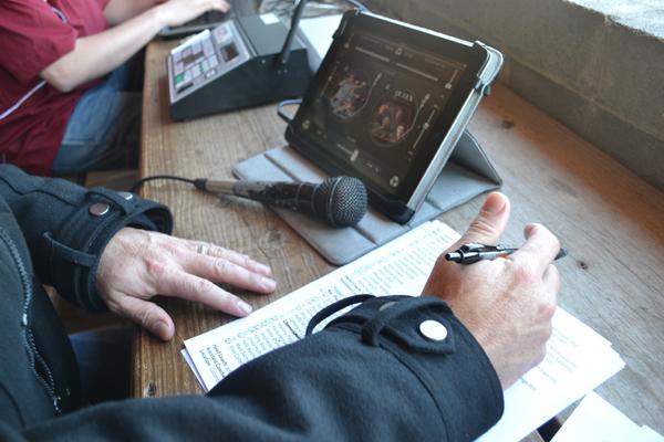 Rich Linden in the media booth of Julian Field during a men's soccer game.