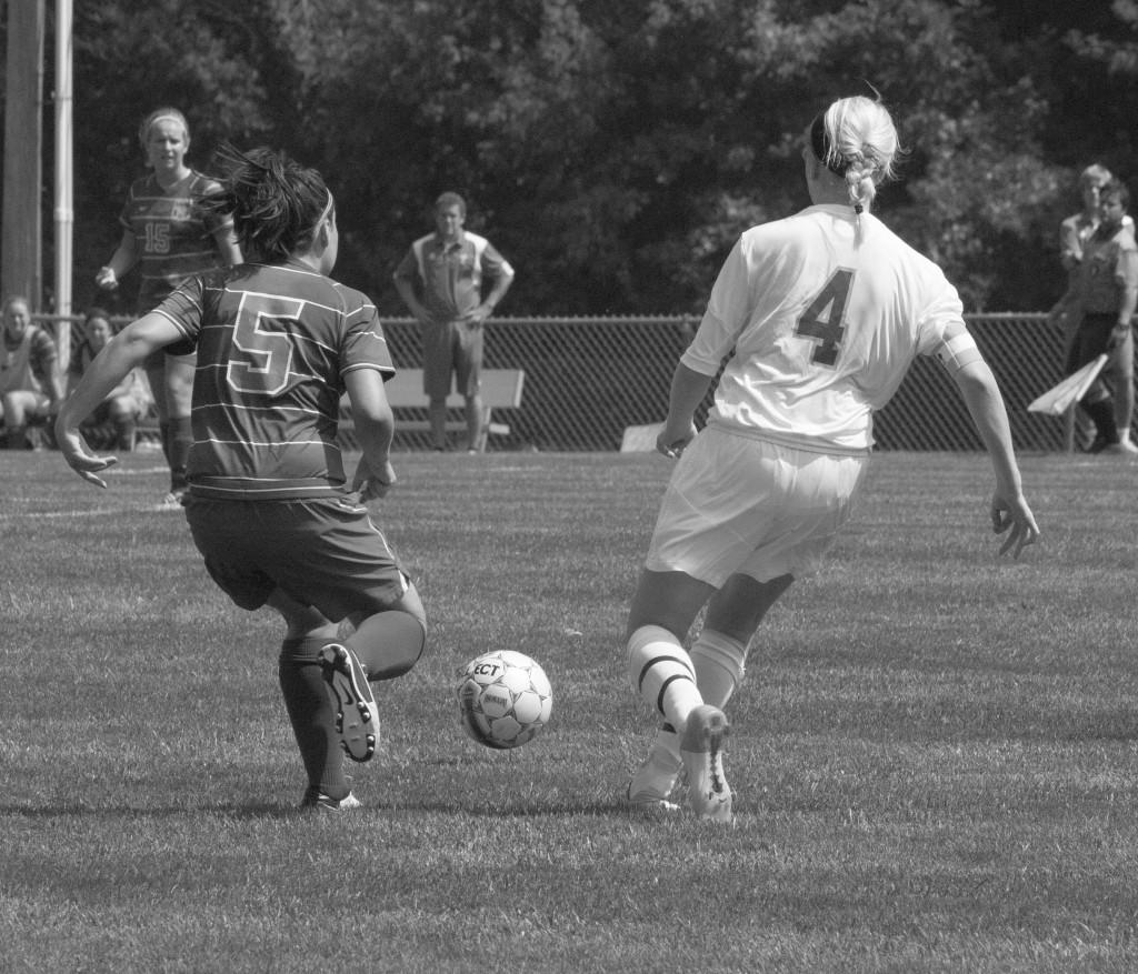 Senior defender Cara Lightle (right) approaches the opposing team. Lightle is from Shawnee, Ks.