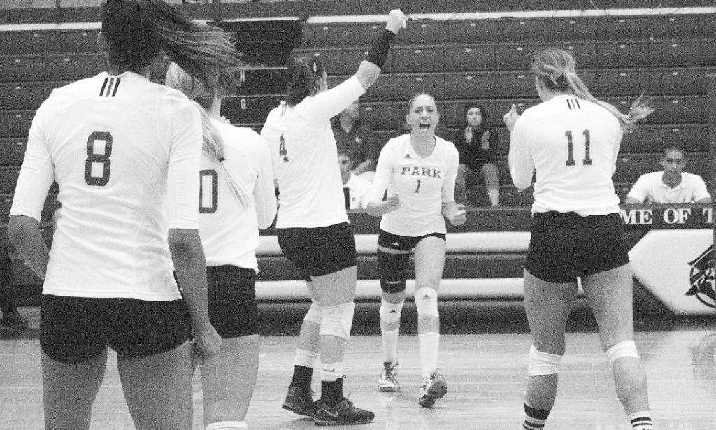 Left to right: Wanessa Siquiera, junior right side, Kat Partridge, senior setter, Juliana Barros, junior setter, Pamela Lima, senior outside hitter, and Lauren Purdy, senior middle blocker, celebrate after an ace.