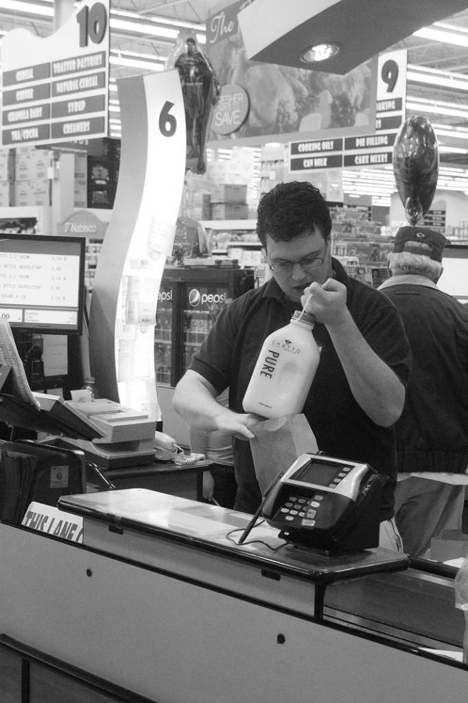 Duncan Reese Vansickle bags groceries for a family of three.