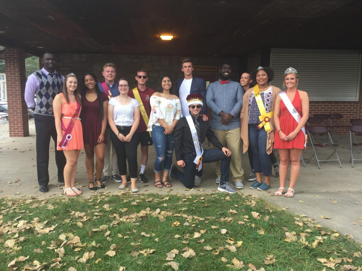 Homecoming candidates for royalty pose for a photo