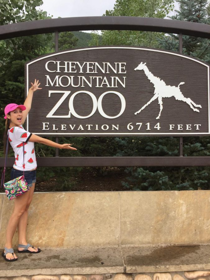 student posing a zoo