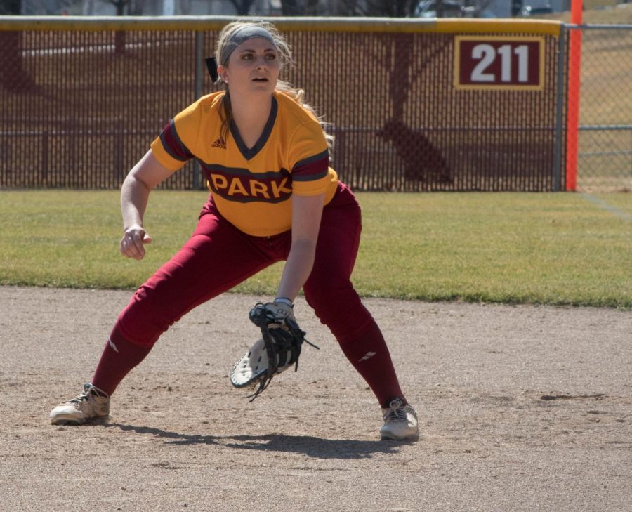 Katie Carr (Junior) at first base focused on the batter.