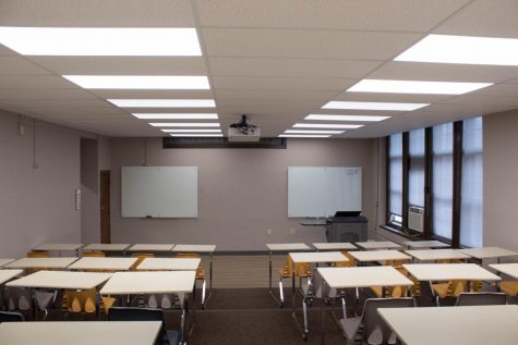 Science Hall room 210. View from where student's sit facing the white boards and professor's podium.