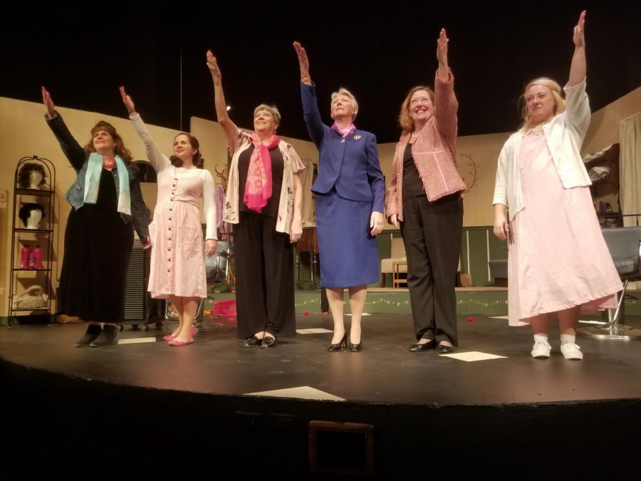 The cast of Steele Magnolias standing on stage in the David Theater at Park University, in order from left to right: Truvy, played by Shelly Richards; Shelby, played by Kim Hentges; Ouiser, played by Vicki Kerns; Clairee, played by Linda Levin; MLynn, played by Nancy Nail; and Annelle, played by Gina Drapela