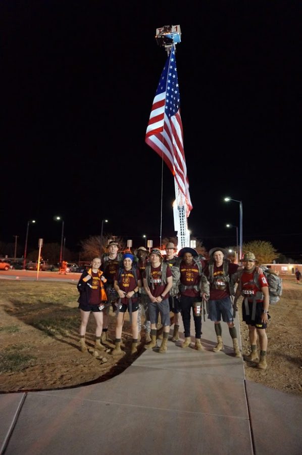 Parks ROTC members posed by the U.S. flag after the 26 mile tribute
