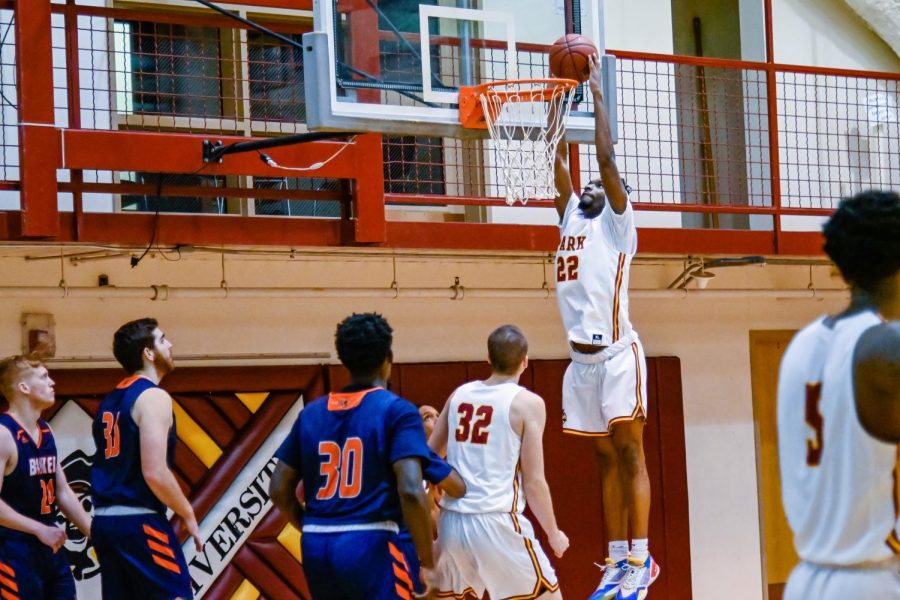 Senior forward Ernest Myles III rises for a dunk as sophomore forward Augusto Hausmann watches on.