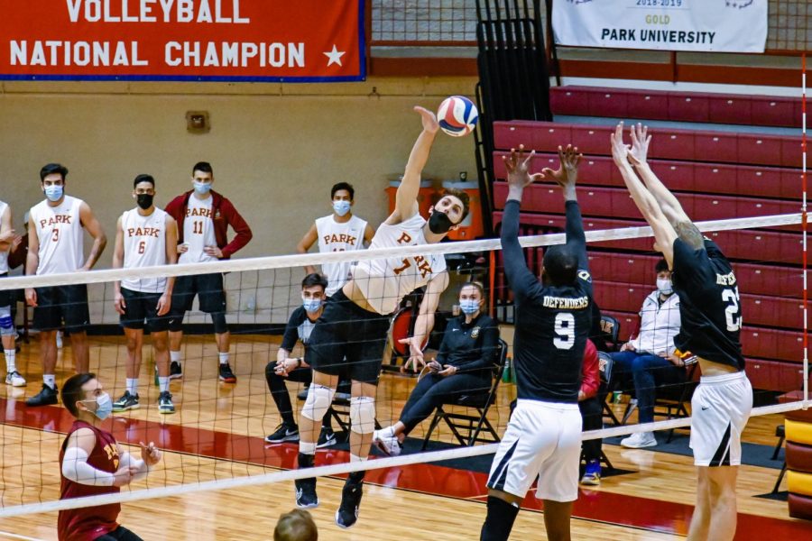 Joao Friedrich jumping to hit the volleyball.