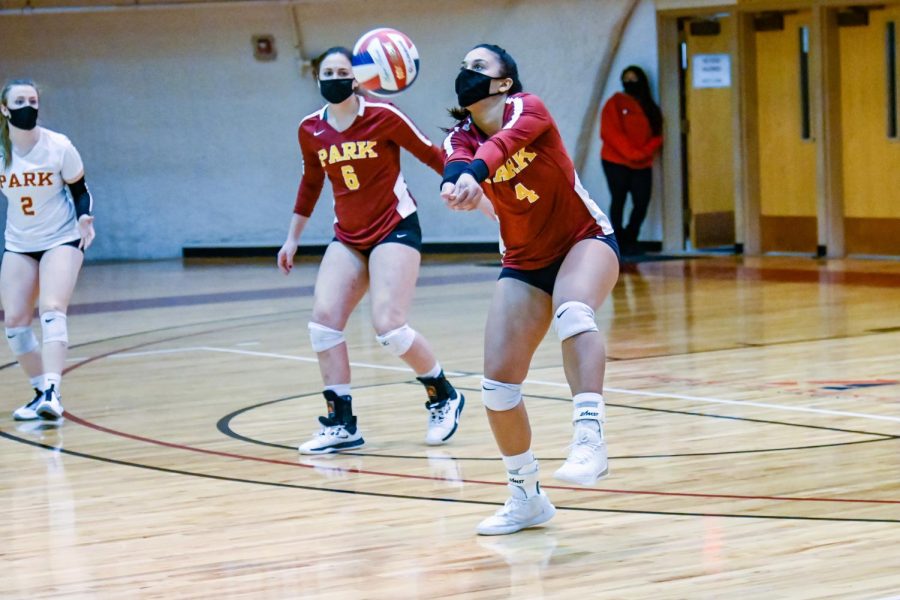 Volleyball player goes to pass the ball.