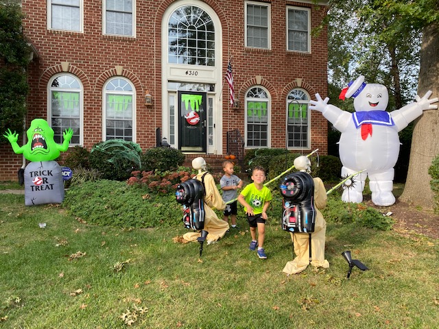 Stephanie Fox and her family decorated their front yard to resemble a scene from the movie "Ghostbusters." Her two sons posed in between the skeleton decorations.