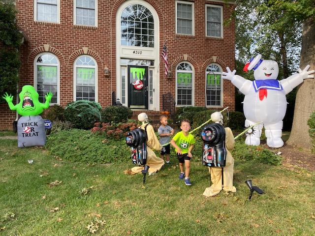 Stephanie+Fox+and+her+family+decorated+their+front+yard+to+resemble+a+scene+from+the+movie+Ghostbusters.+Her+two+sons+posed+in+between+the+skeleton+decorations.