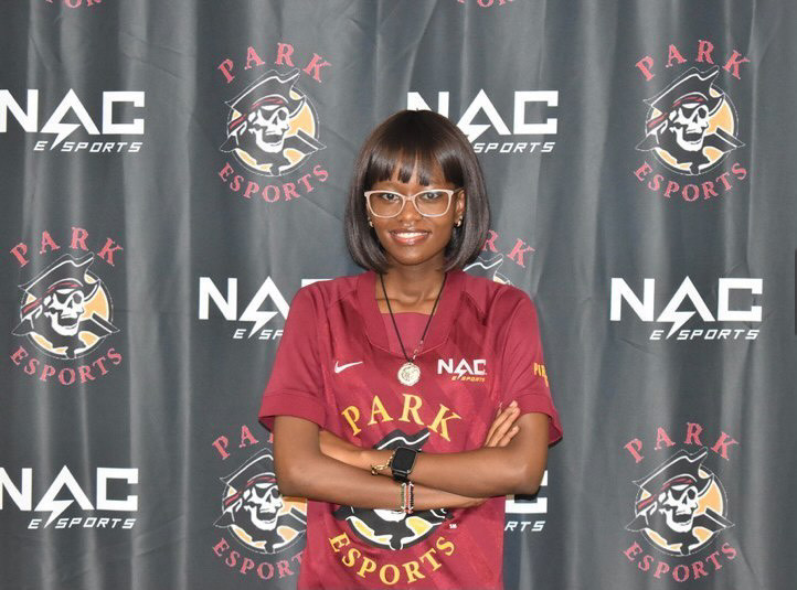 Yvette Karanja poses in her Esports team shirt.