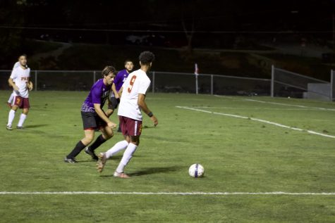 Park soccer player prepares to shoot goal