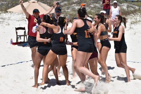 The team celebrates after a
win while in Florida. During pool
play, Park beat Webber International
University.