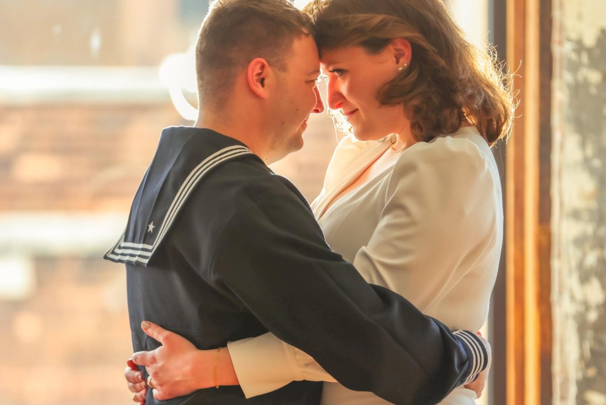 Damon Grosvenor, left, and Ashlyn Weber, right, pose for an engagement photograph.