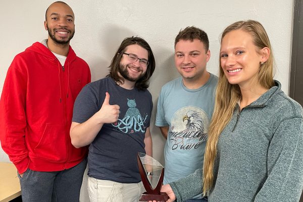 From left to right, editors Bryce Butler, Nathan Matthews and Damon Grosve-nor and Editor-in-Chief Skyler Jensen, who were four of the members of The Stylus’ team for the spring semester, pose with a trophy the paper earned during the annual Dr. Doris A. Howell Leadership Awards.